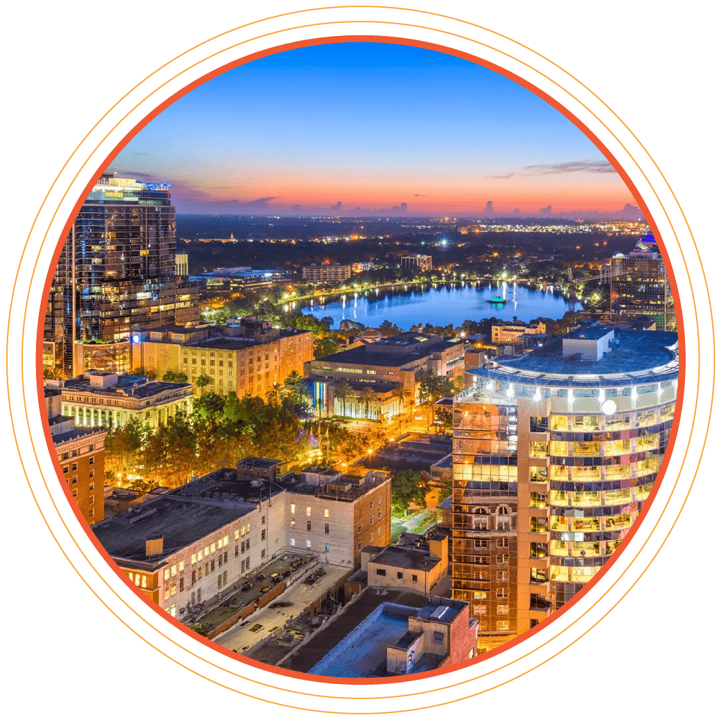 Photo of Orlando at night with glowing lights, glow on horizon from sunset.